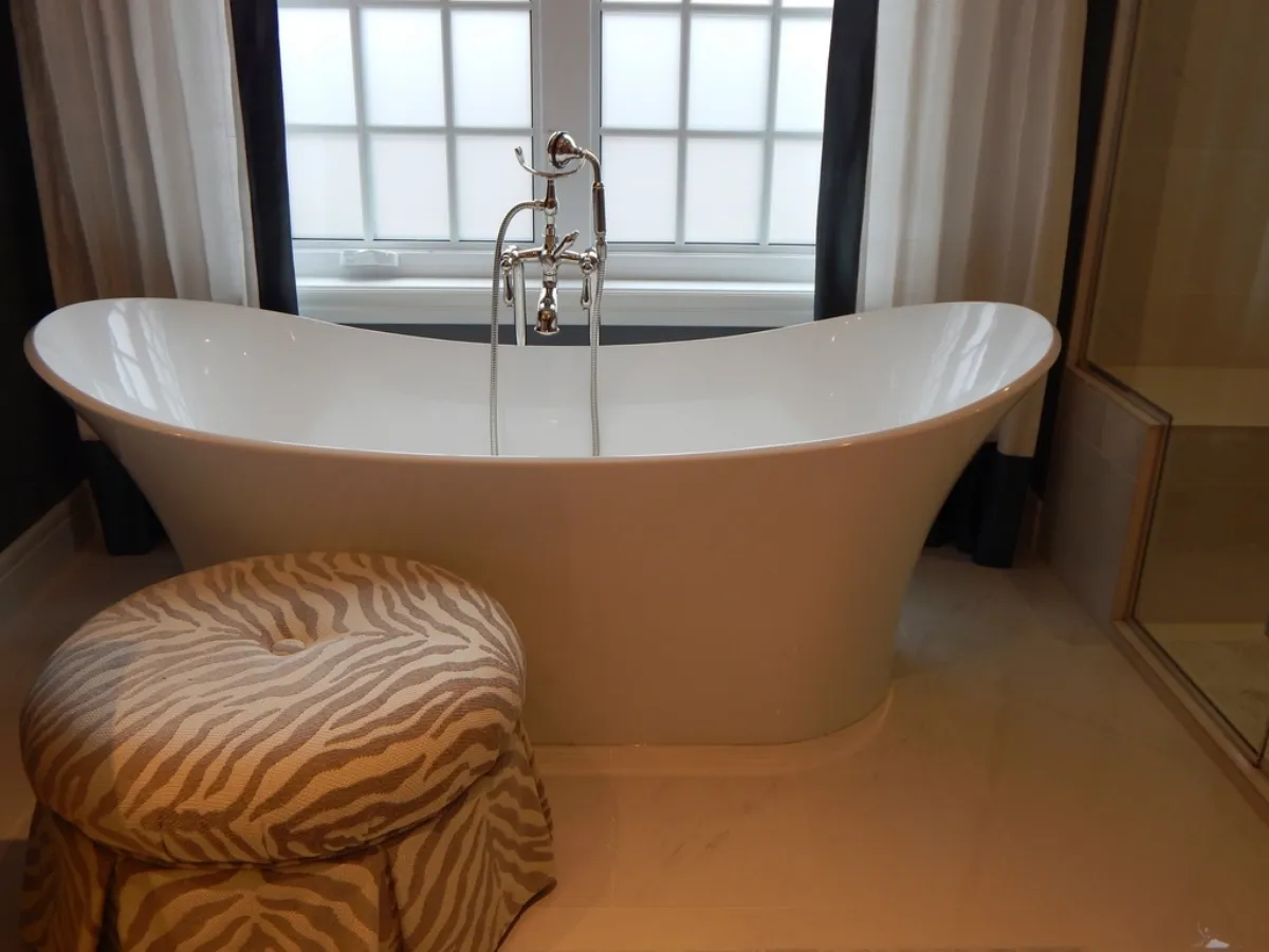 Warm, characterful bathroom with a freestanding slipper tub