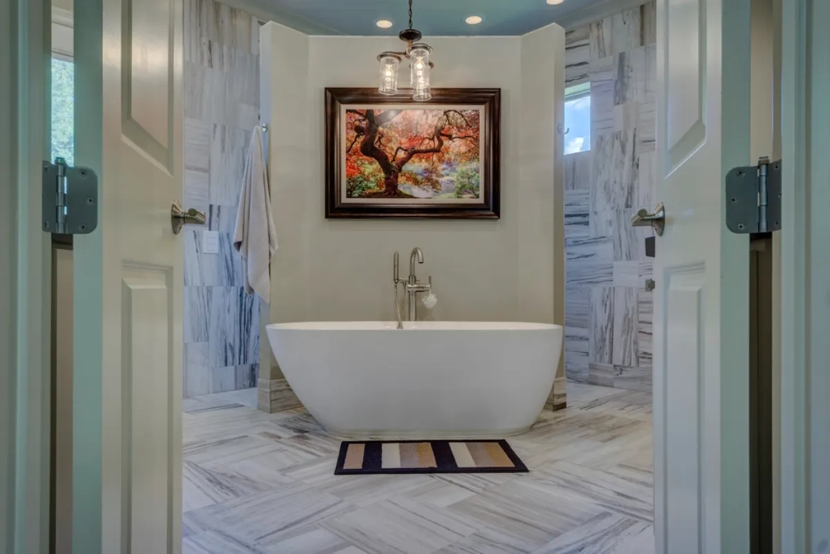 Bathroom with a freestanding tub and a glass shower enclosure